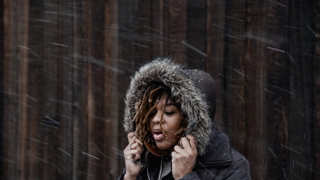 Woman Outside in Light Snow Blizzard